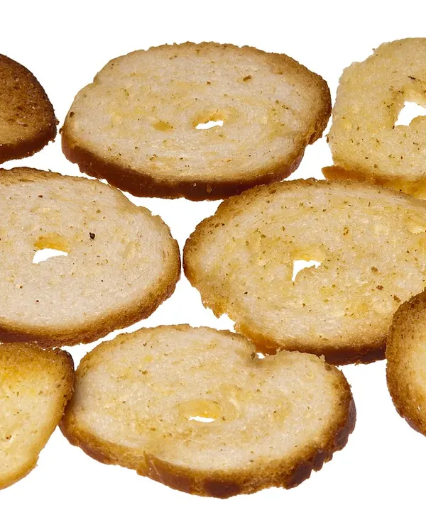 Thin toasted bagel slices on white