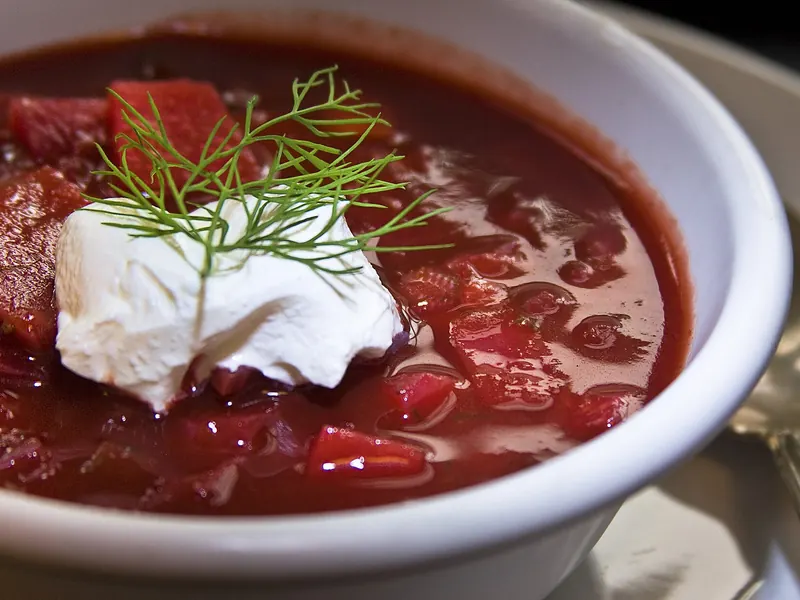 Bowl of beet borscht with sour cream and dill