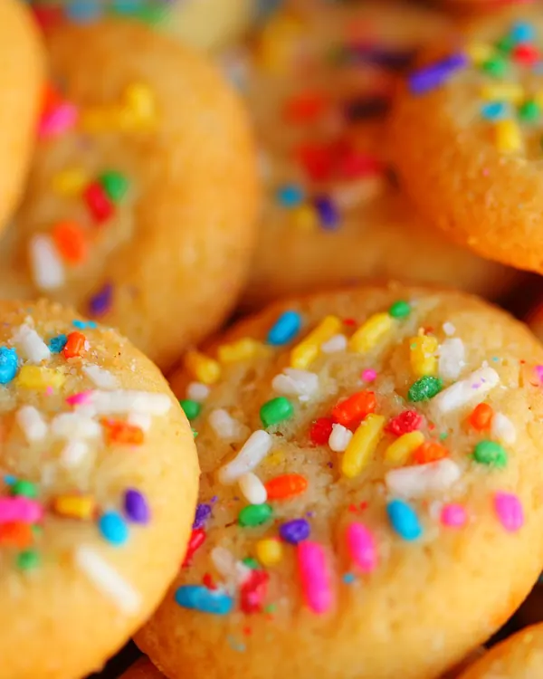 Sugar cookies covered in rainbow sprinkles
