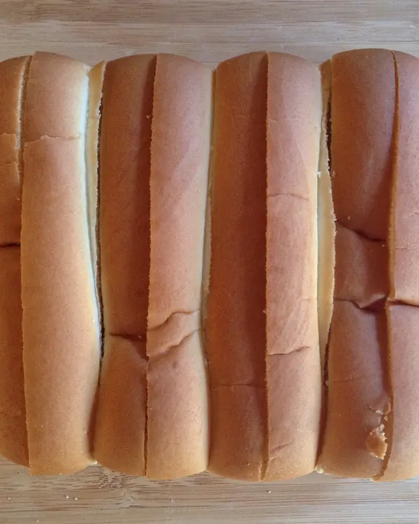 Four hot dog buns seen from above