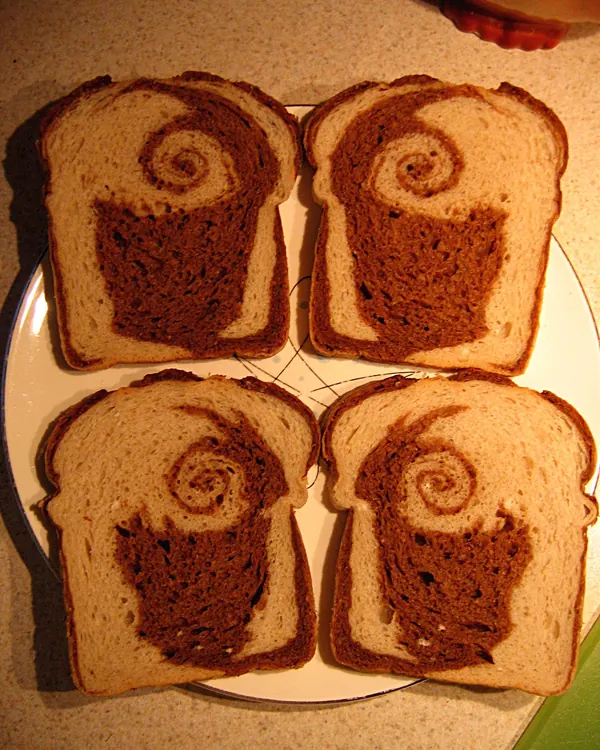Slices of marble rye with a dark and light swirl