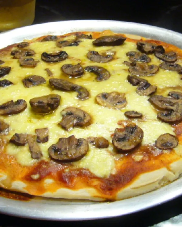 Mushroom pizza on a metal tray