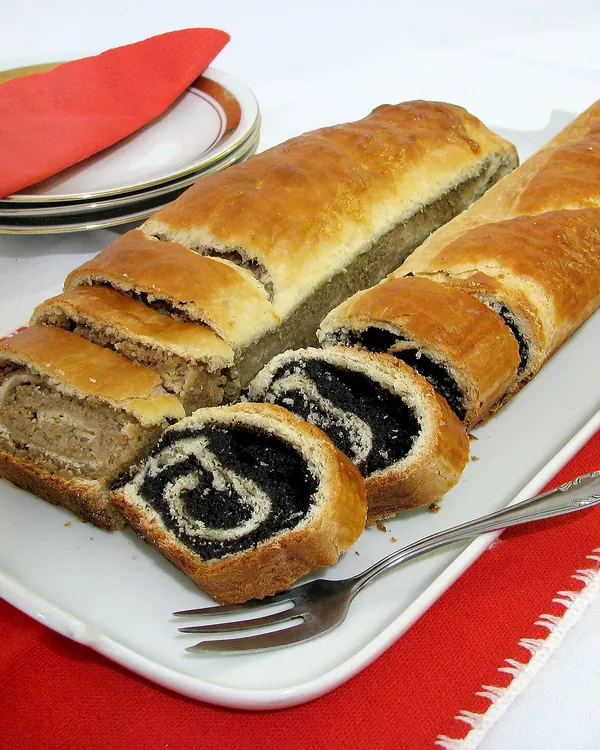 Sliced poppy seed roll on a plate
